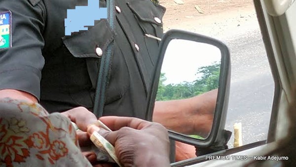 Breaking: Extortion taken too far: Drama as Police officer with POS machine, demands ATM card from Nigerians