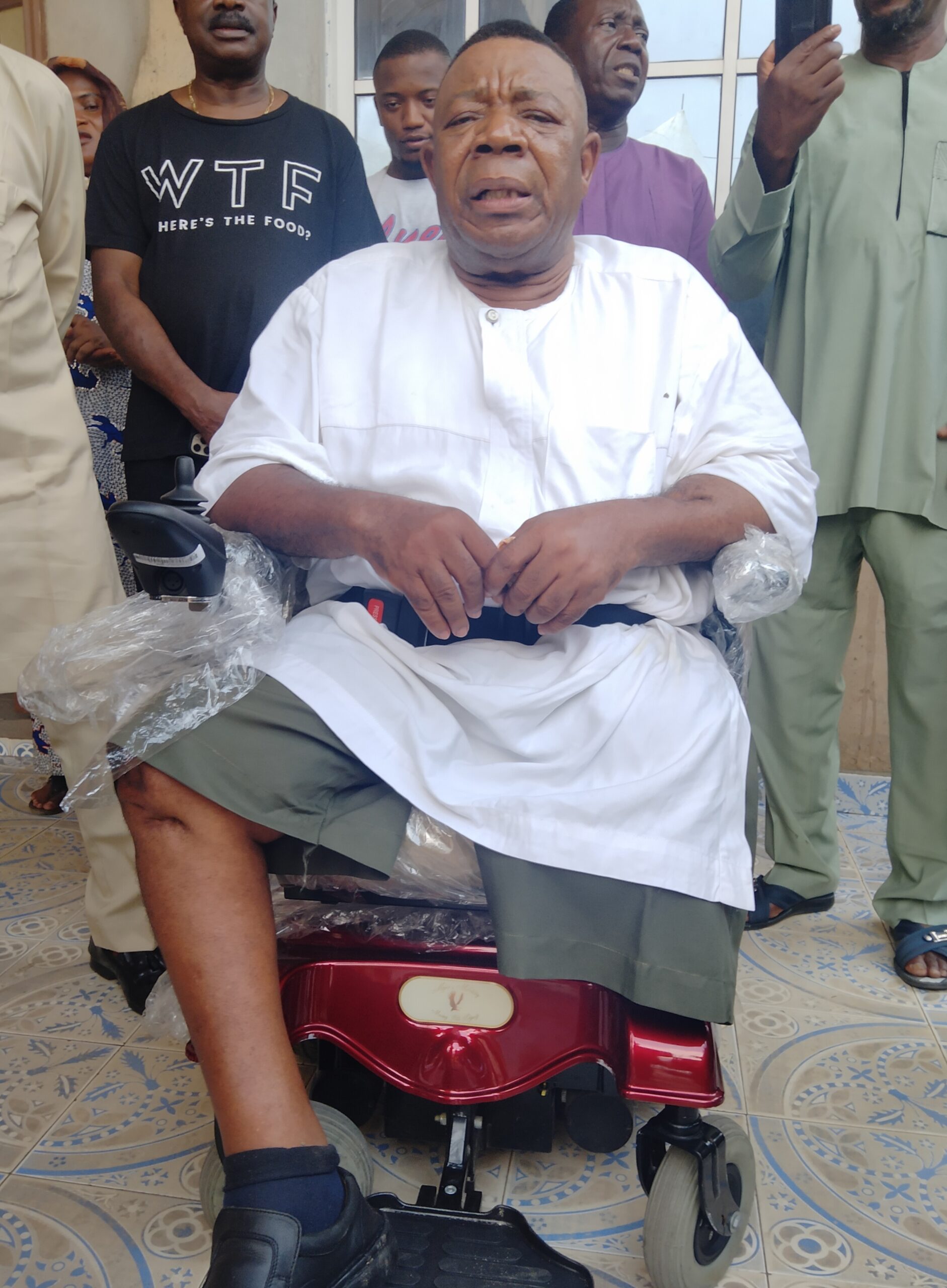 Pomp As Prof  Emeghara Receives 'Rosy Gift' Of Motorized Wheel Chair From Old Girl ( VIDEO)